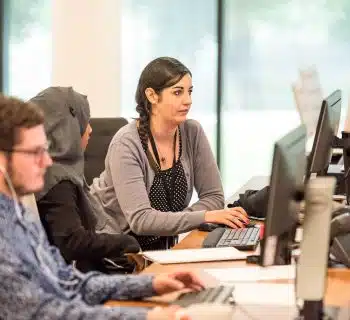 unknown persons using computer indoors