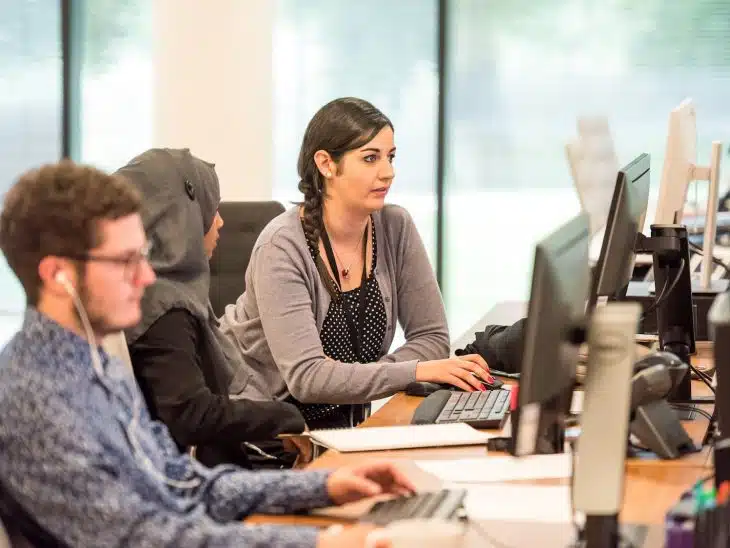 unknown persons using computer indoors